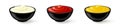 Mayonnaise, tomato ketchup and mustard sauces in black bowls on white background. Side view